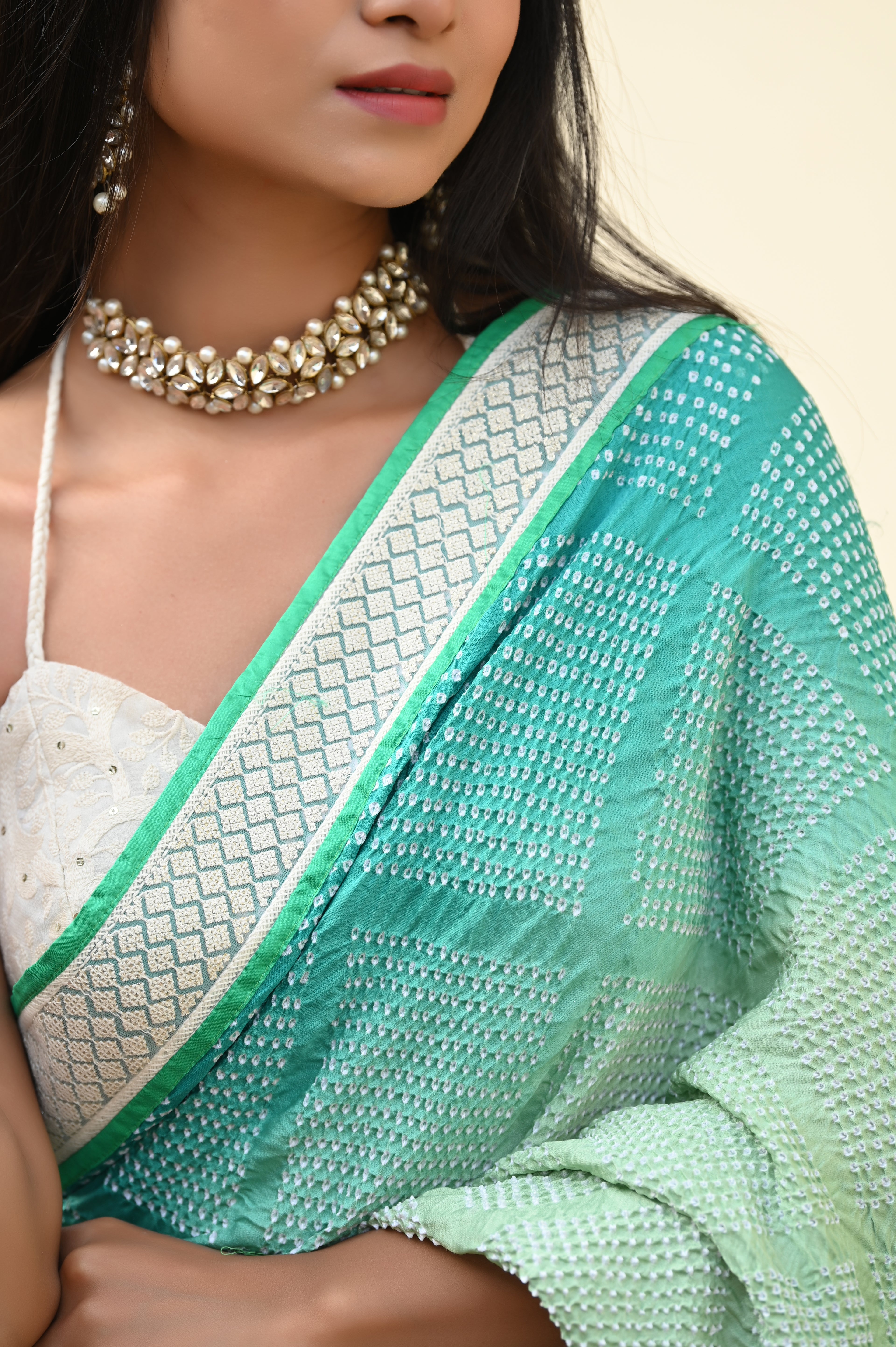 LIGHT GREEN DIAMOND GEOMETRIC BANDHANI SAREE WITH LACE BORDER AND TASSELS
