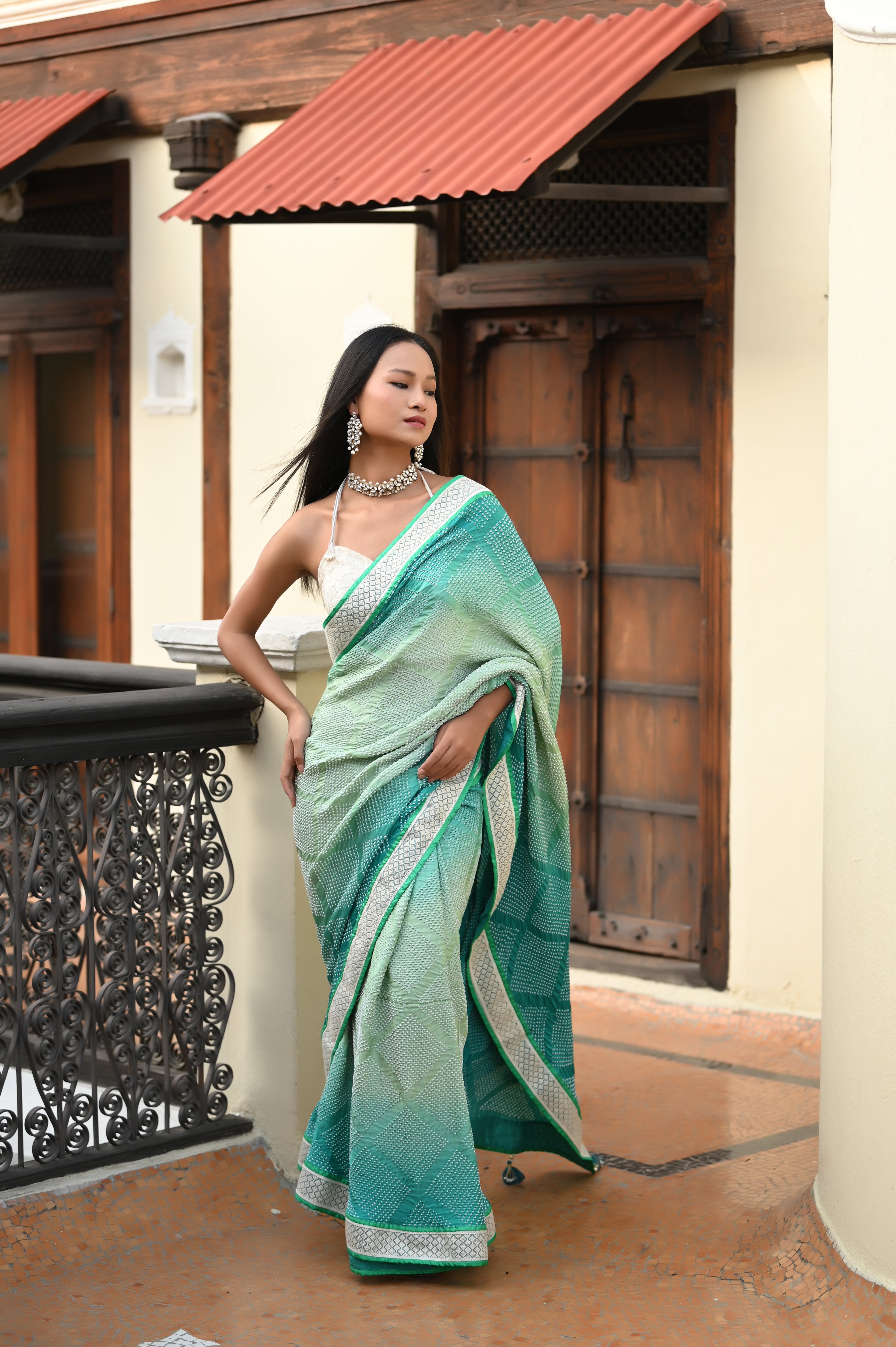 LIGHT GREEN DIAMOND GEOMETRIC BANDHANI SAREE WITH LACE BORDER AND TASSELS