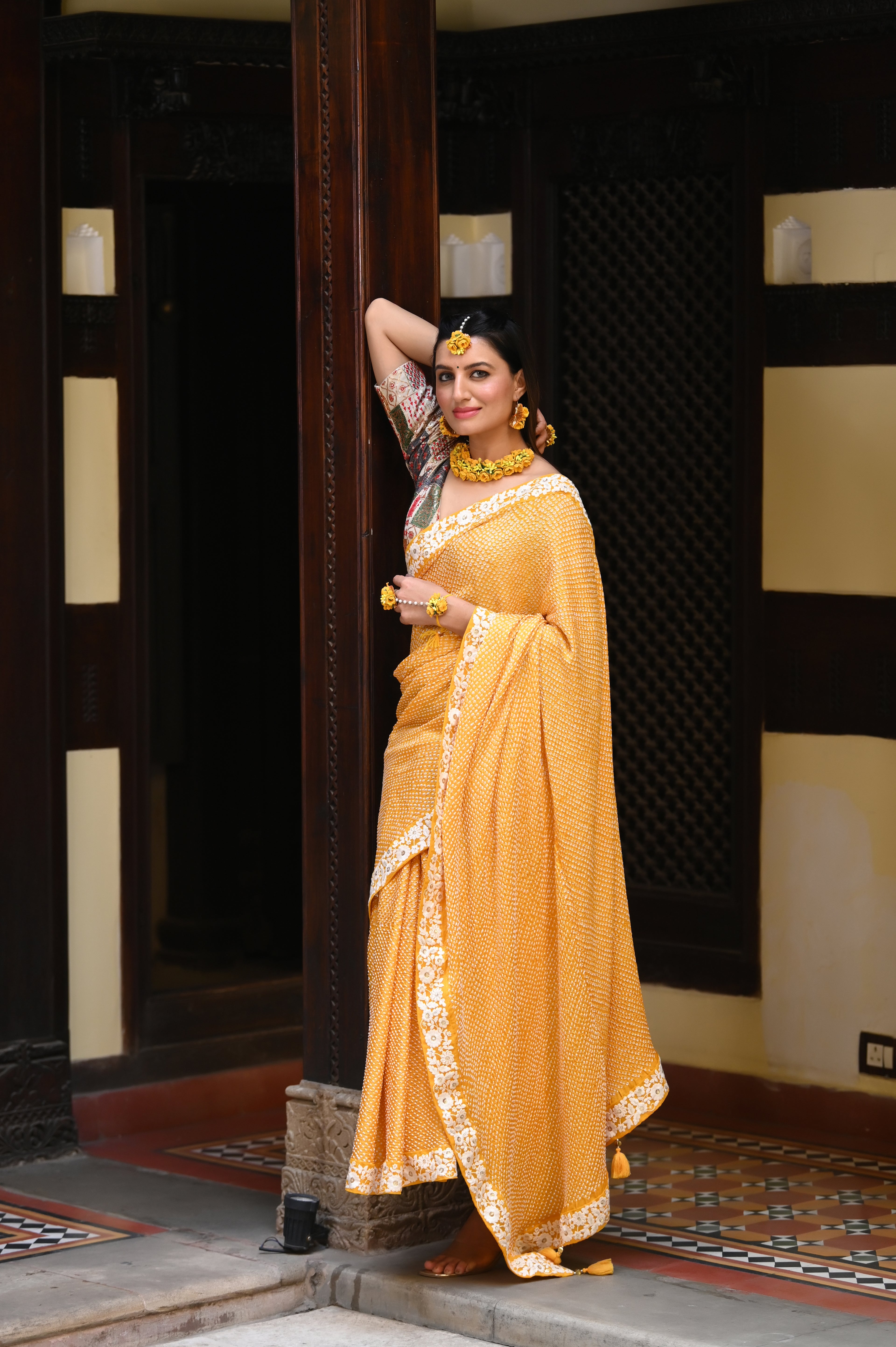 YELLOW ETERNAL DOTS BANDHANI SILK SAREE WITH LACE BORDER AND TASSELS