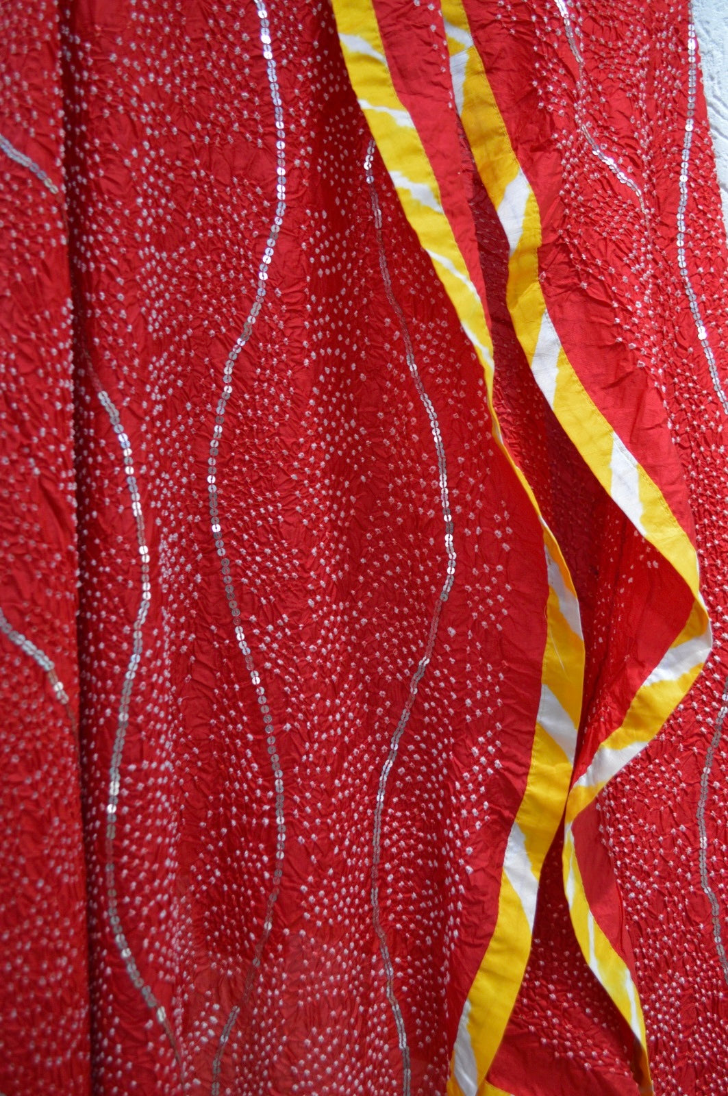 RED ETERNAL DOT BANDHANI SILK DUPATTA WITH KUTCH BORDER AND SEQUIN WORK