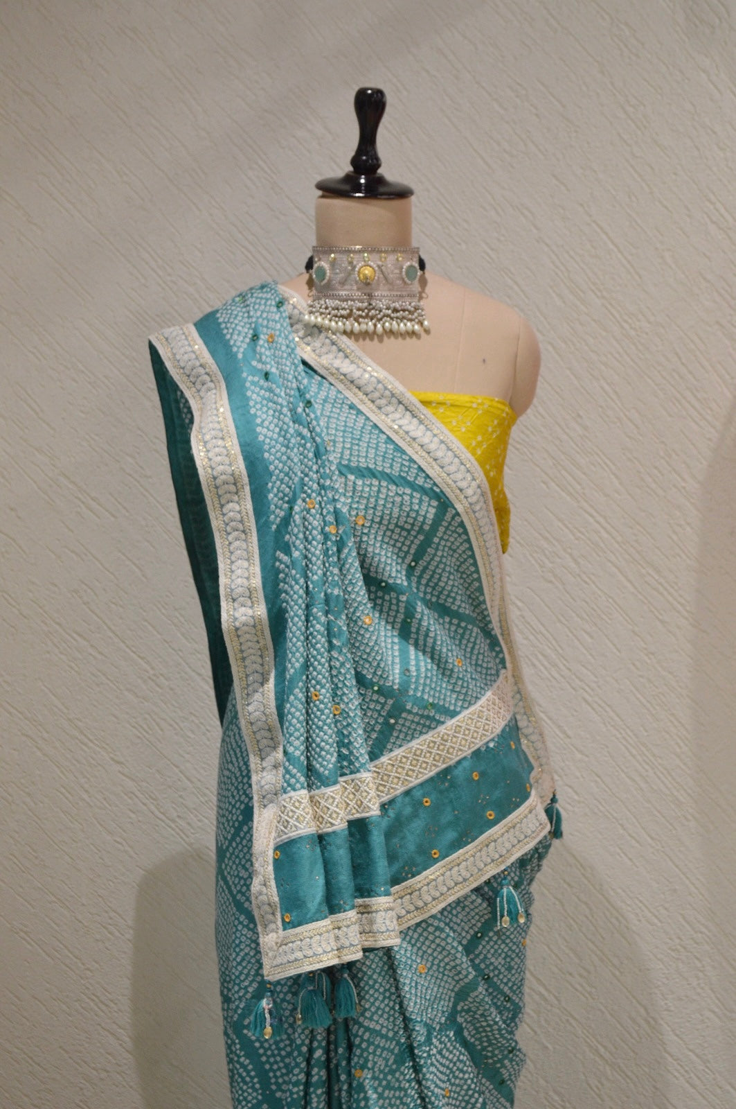 LIGHT BLUE DIAMOND SILK BANDHANI SAREE WITH MIRROR WORK, TASSELS AND BORDER
