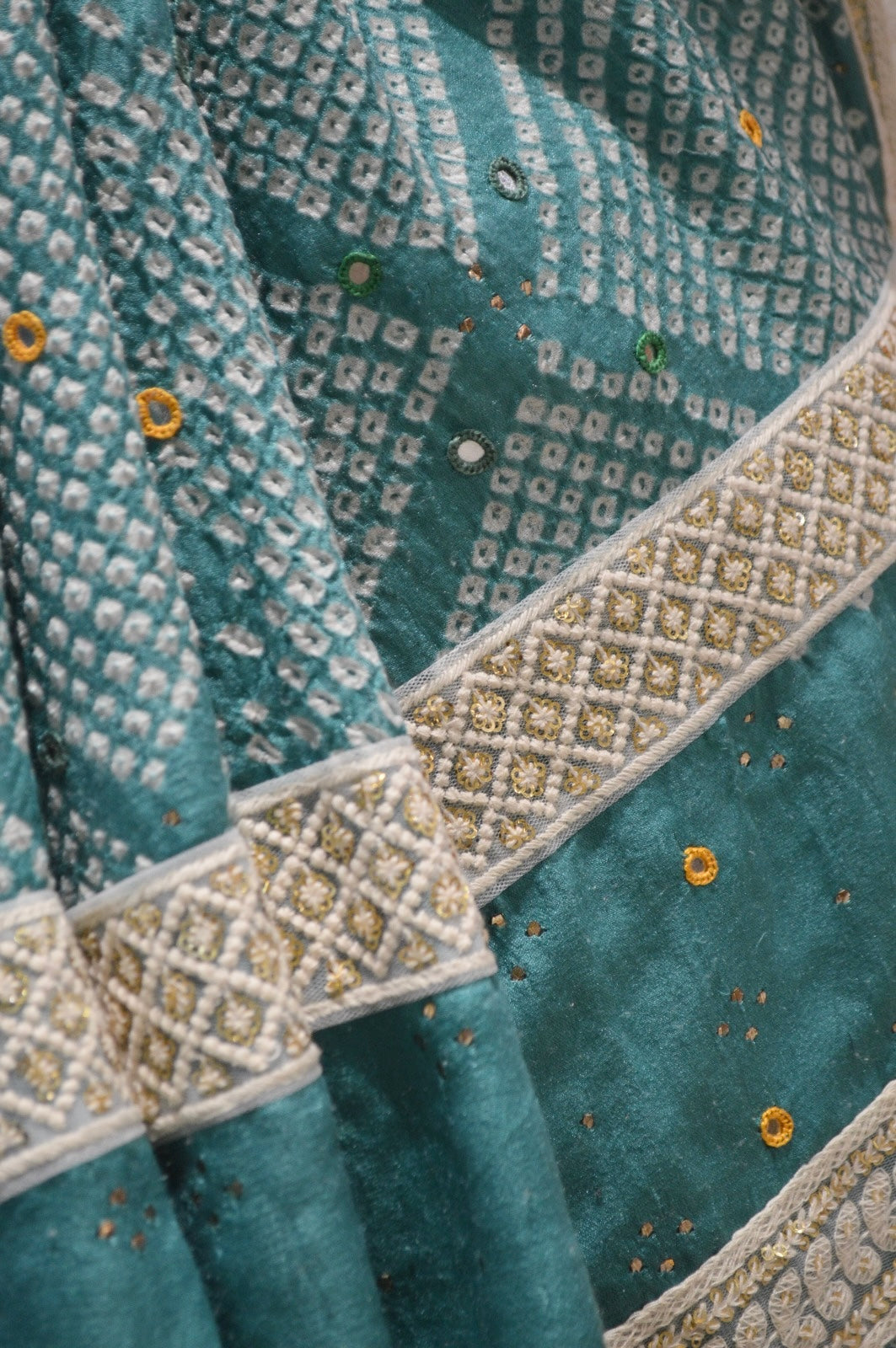 LIGHT BLUE DIAMOND SILK BANDHANI SAREE WITH MIRROR WORK, TASSELS AND BORDER