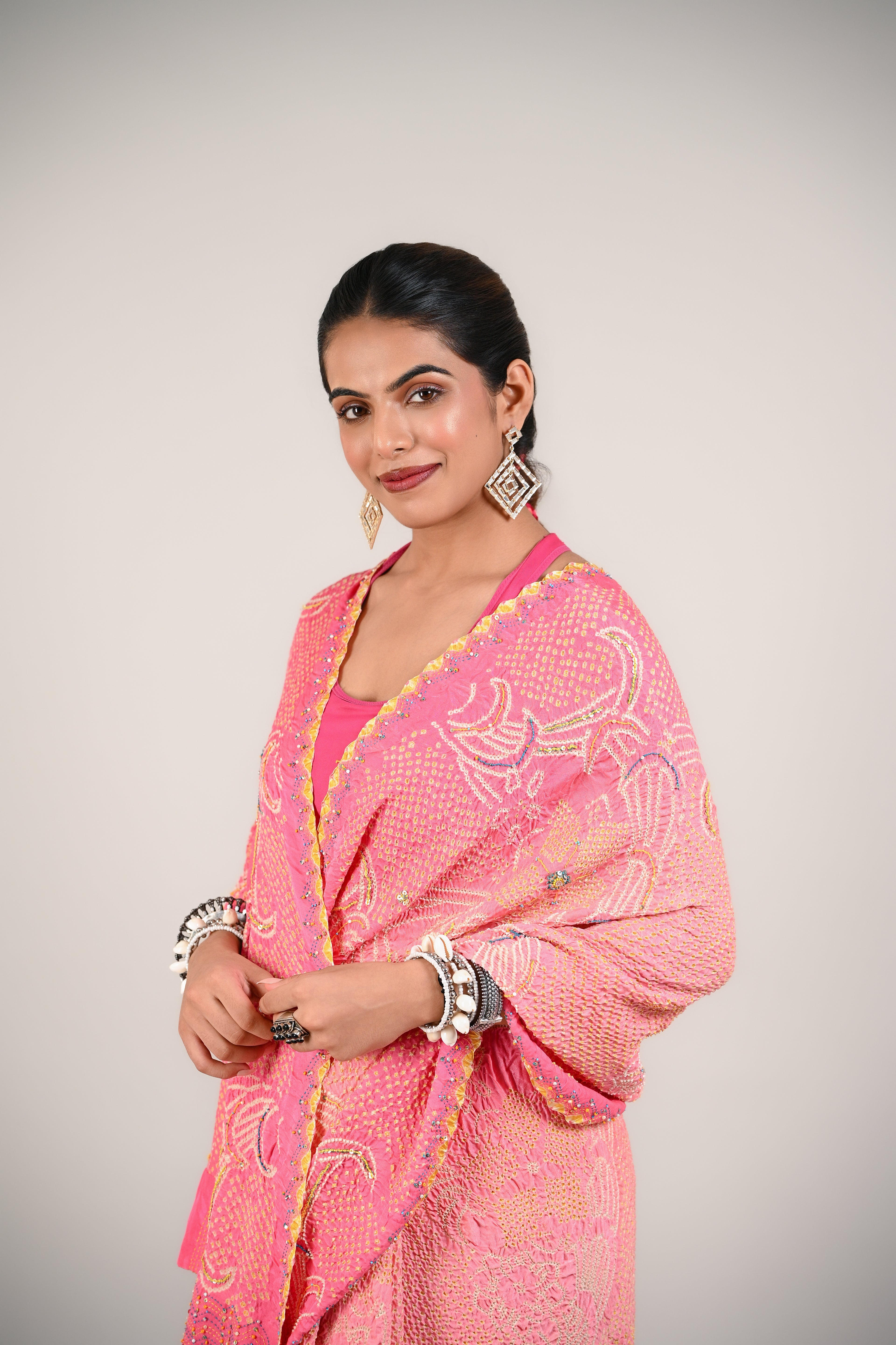 PEACH-PINK FLORAL BANDHANI SILK SAREE WITH EMBROIDERY AND TASSELS