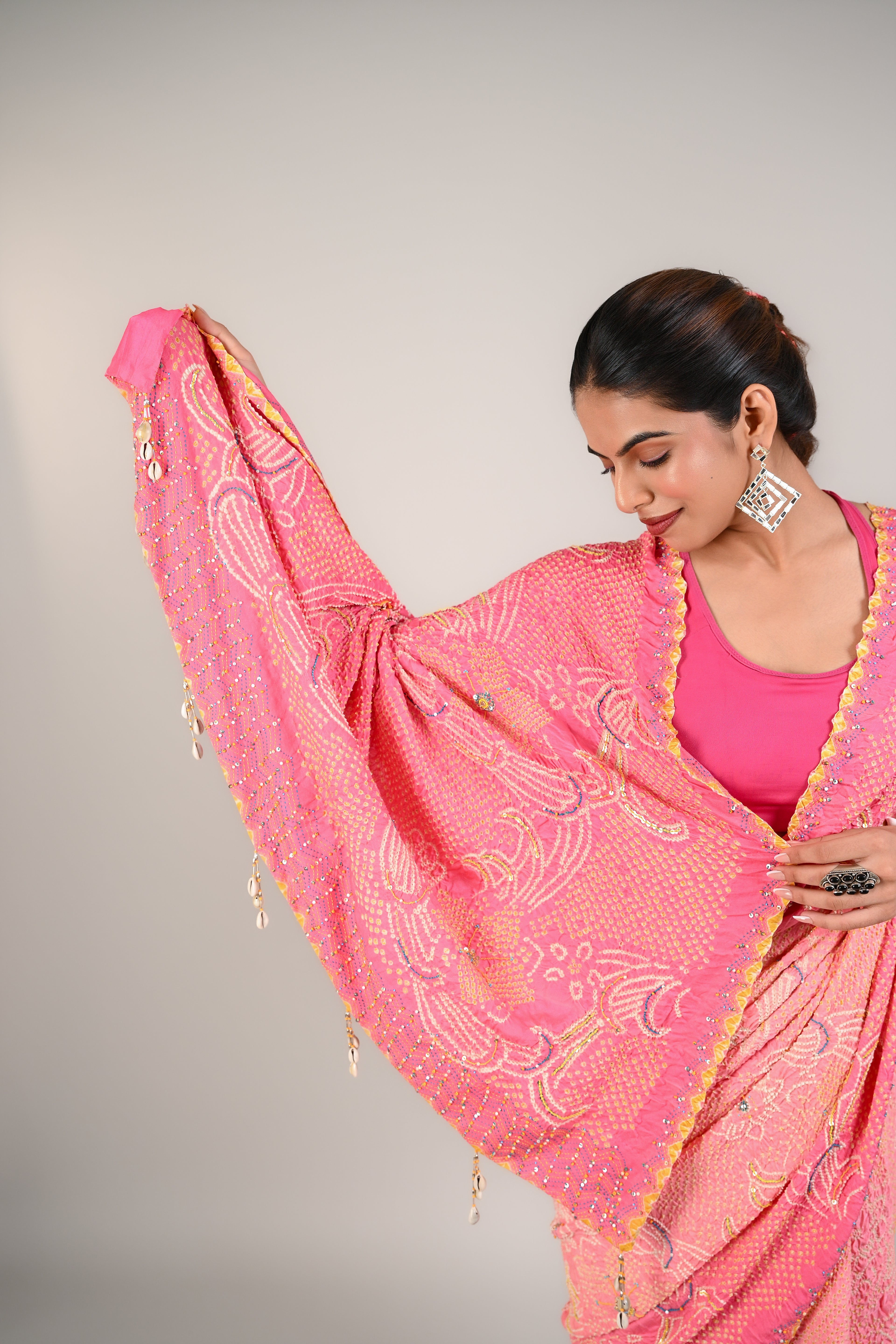 PEACH-PINK FLORAL BANDHANI SILK SAREE WITH EMBROIDERY AND TASSELS
