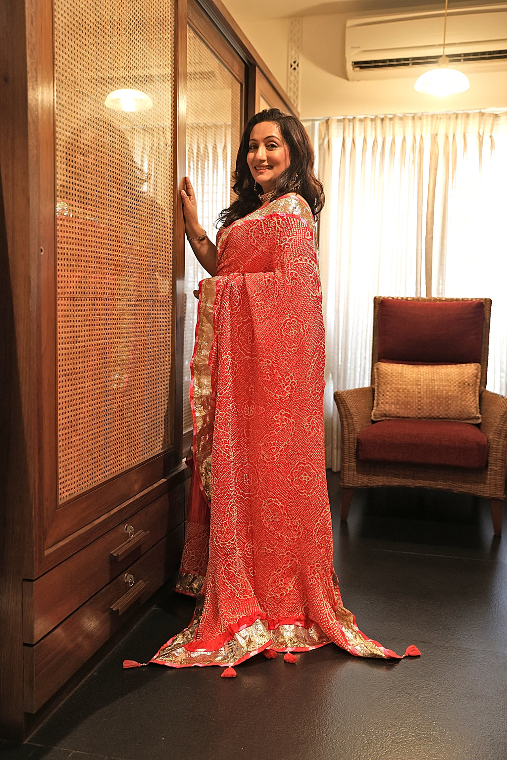 ORANGE-PINK YIN-YANG HALF FULL HALF EMPTY PAISLEY BANDHANI SILK SAREE WITH LAMPI BORDER