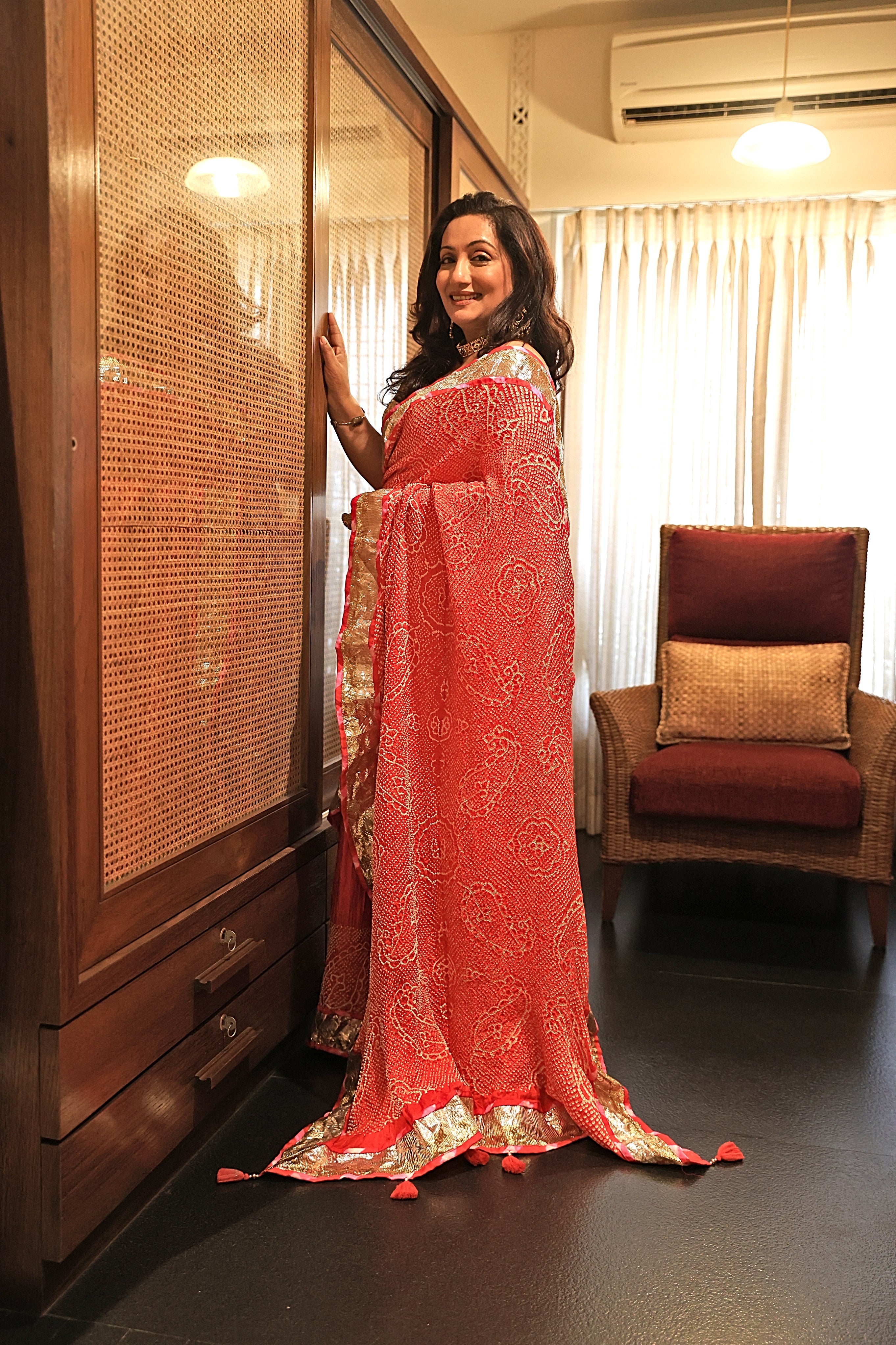 ORANGE-PINK YIN-YANG HALF FULL HALF EMPTY PAISLEY BANDHANI SILK SAREE WITH LAMPI BORDER