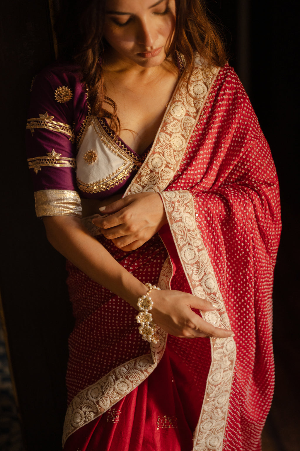 RED YIN-YANG” HALF FULL HALF EMPTY ETERNAL DOTS SILK BANDHANI SAREE WITH EMBROIDERY AND EMBROIDERED LACE