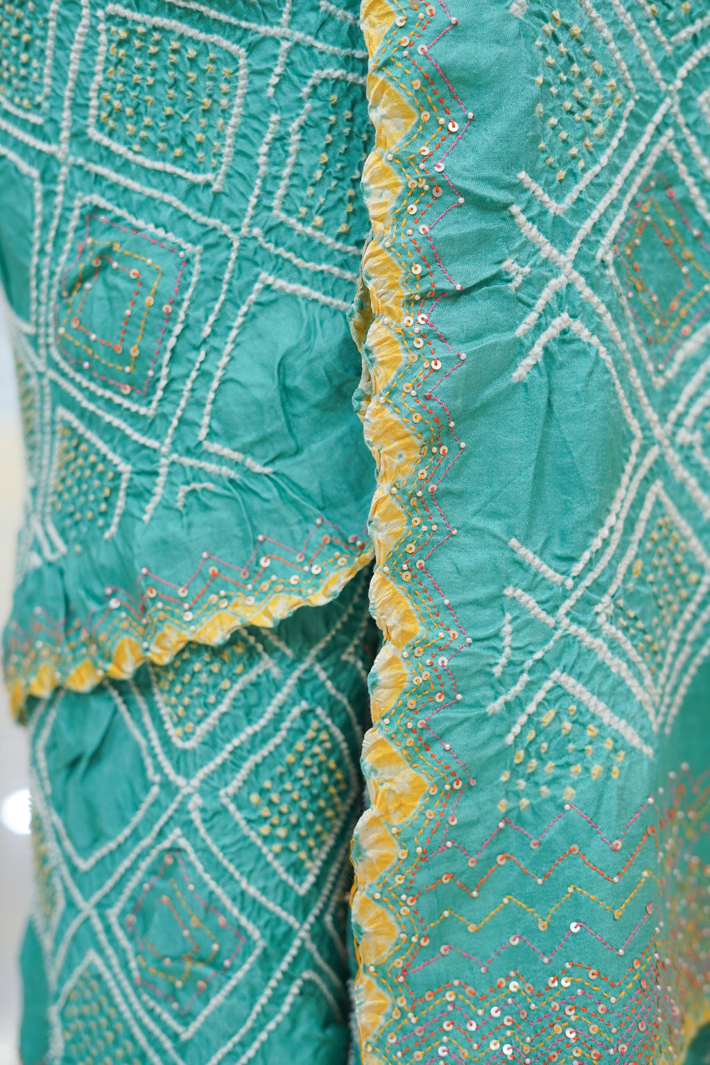 LIGHT BLUE DIAMOND GEOMETRIC SILK BANDHANI SAREE WITH HAND EMBROIDERY AND TASSELS