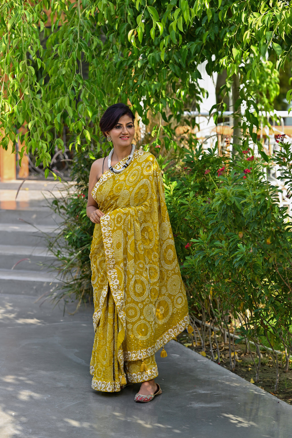 MUSTARD YELLOW CIRCLES OF THE LIFE BANDHANI SILK SAREE WITH MIRROR WORK AND LACE BORDER